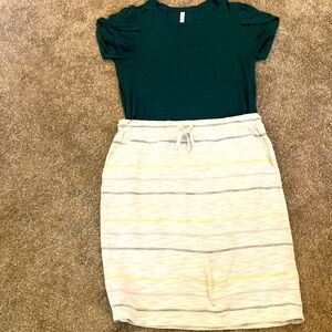 skirt and top with silver bangle. I am 5’2” and the skirt hits below the knee.